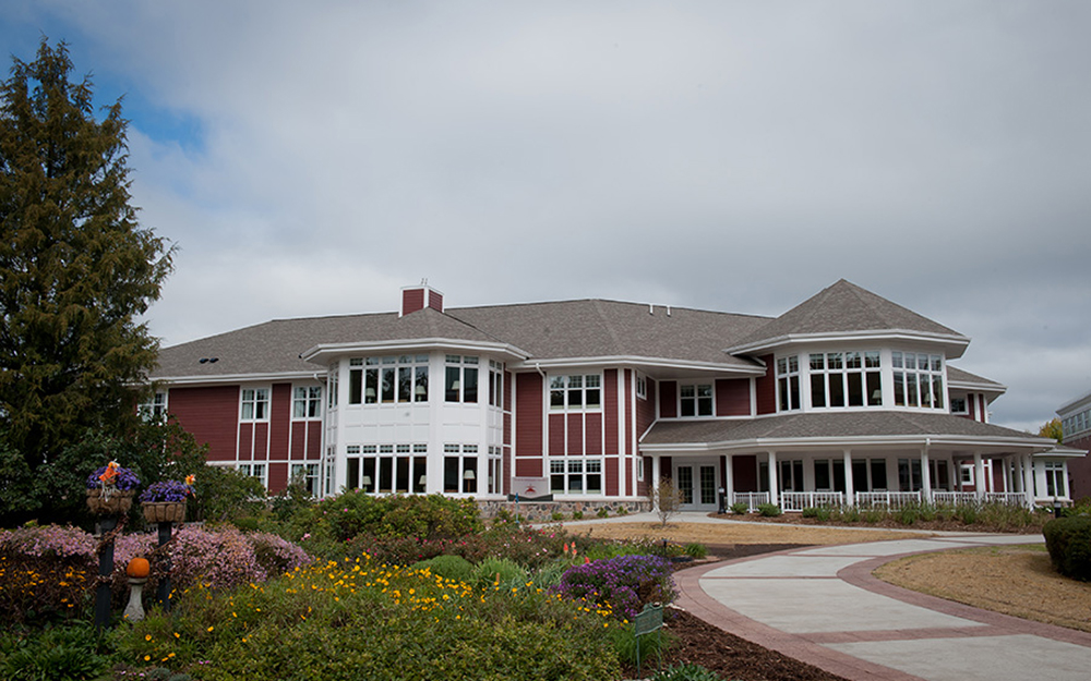 Residential Care large beautiful building with flowers