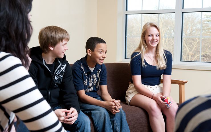Children on couch smiling