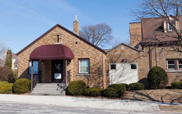 Brick building with maroon awning