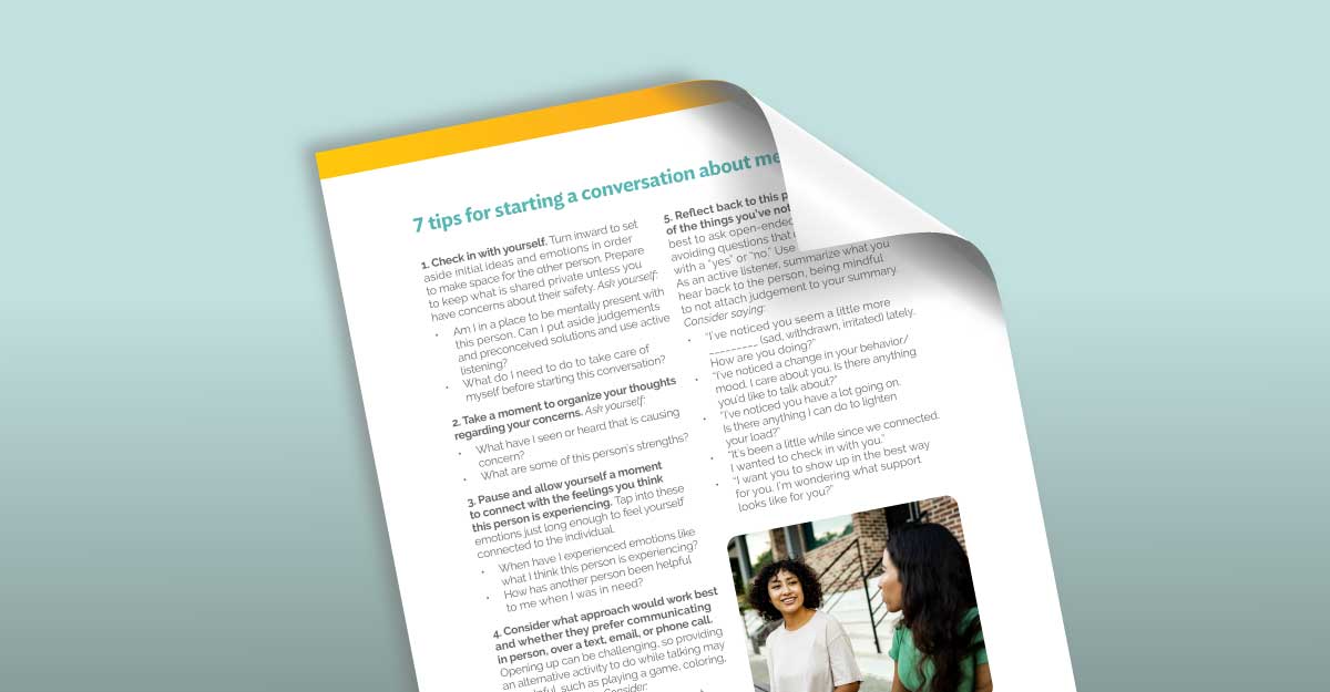 Sheet of paper titled "7 tips for starting a conversation about mental health" with a photo of two people at the bottom.