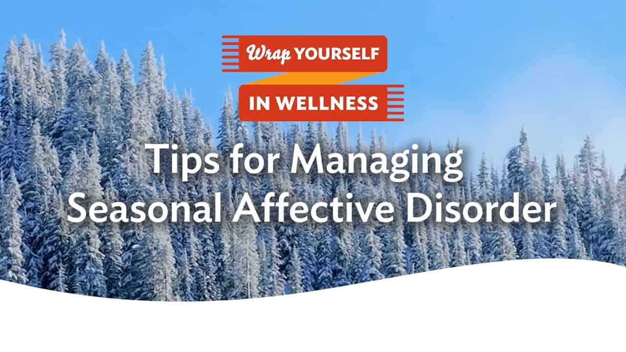 Snowy forest with text: "Tips for Managing Seasonal Affective Disorder" and "Wrap Yourself In Wellness" in an orange ribbon.