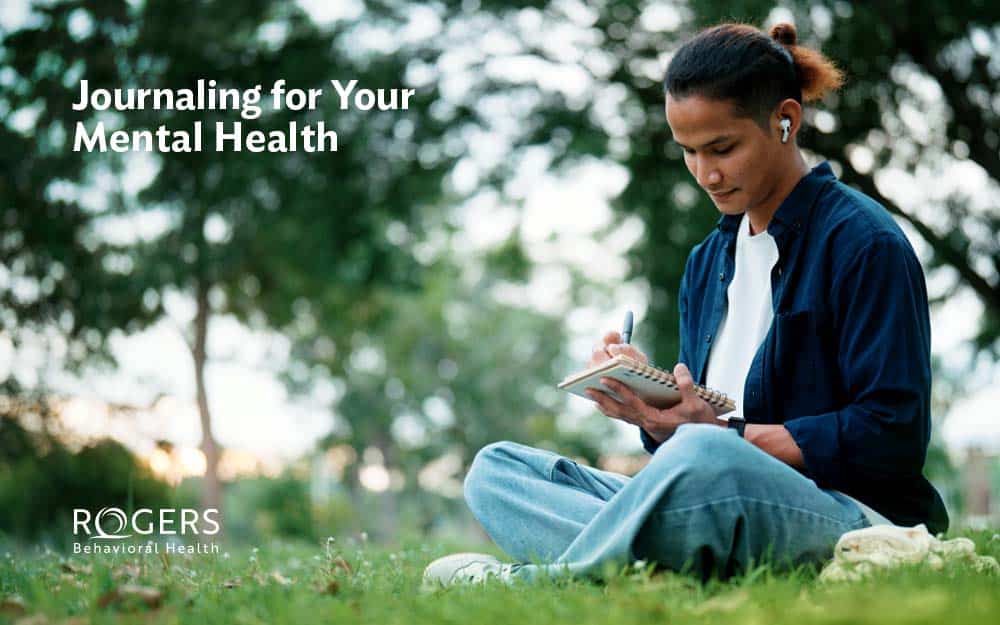 The image shows a young man journaling in a park for his mental health. Text says: Journaling for Your Mental Health