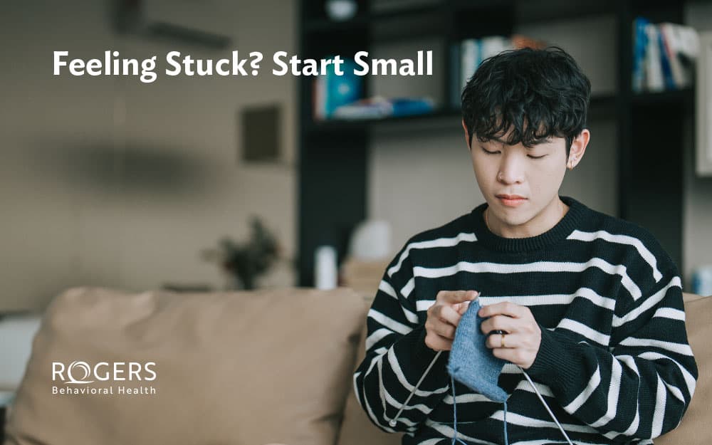 Image shows boy knitting as a small step action to help his depression.