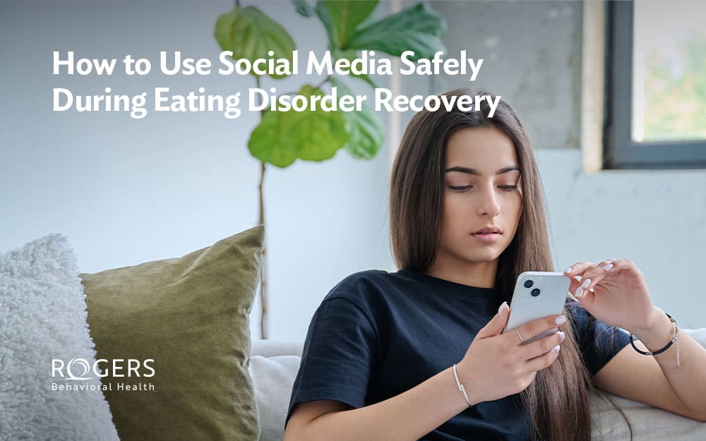 A young woman in recovery from an eating disorder curating her social media feed
