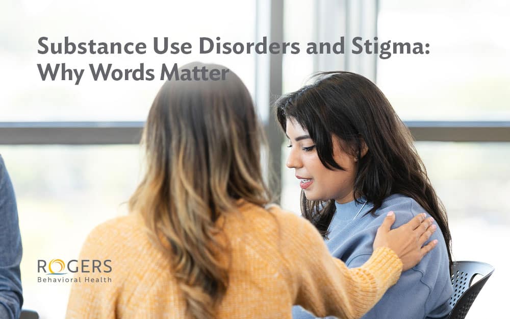 A woman has her hand on the shoulder of her friend who is struggling with substance use, Text says: Substance Use Disorders and Stigma: Why Words Matter