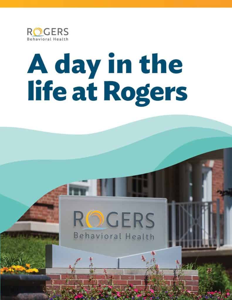 Cover of the Rogers Behavioral Health booklet titled “A day in the life at Rogers,” featuring layered green wave graphics above a photo of a Rogers Behavioral Health sign, landscaping, and building entrance.